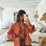 Blusa de lino con mangas globo en color terracota